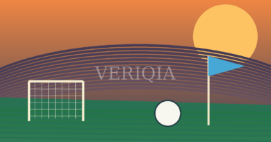 Football pitch at golden hour with blue corner flag, goal and ball with centered VERIQIA watermark