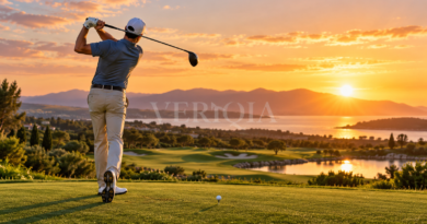 Golfer following through on a drive beside a sunset fairway